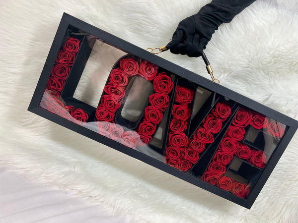Love suitcase with preserved roses