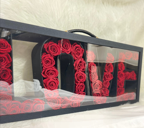 Love suitcase with preserved roses